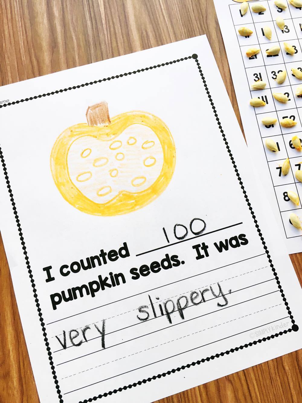 Use a hundreds chart to help students count pumpkin seeds.